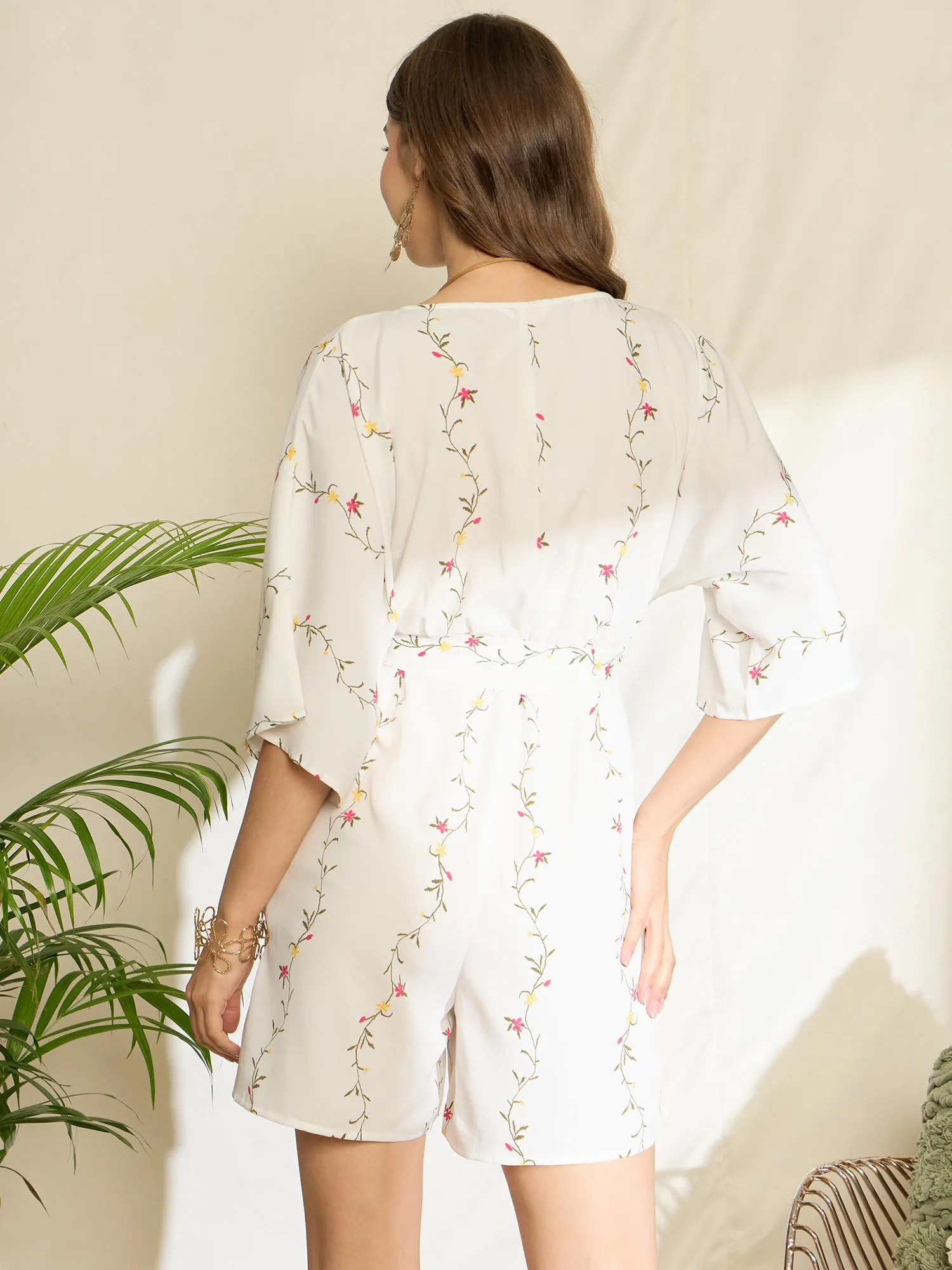 Berrylush Women White Floral Print V-Neck Belted Mini Jumpsuit