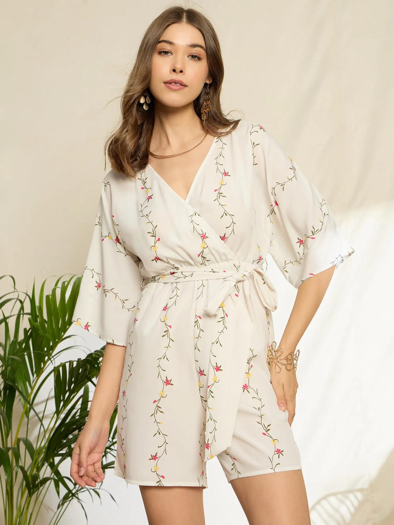 Berrylush Women White Floral Print V-Neck Belted Mini Jumpsuit