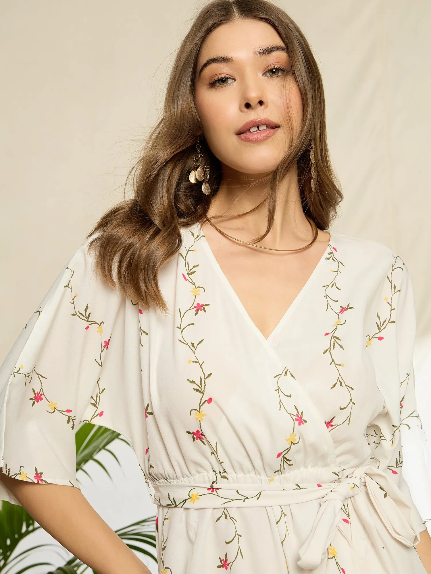 Berrylush Women White Floral Print V-Neck Belted Mini Jumpsuit