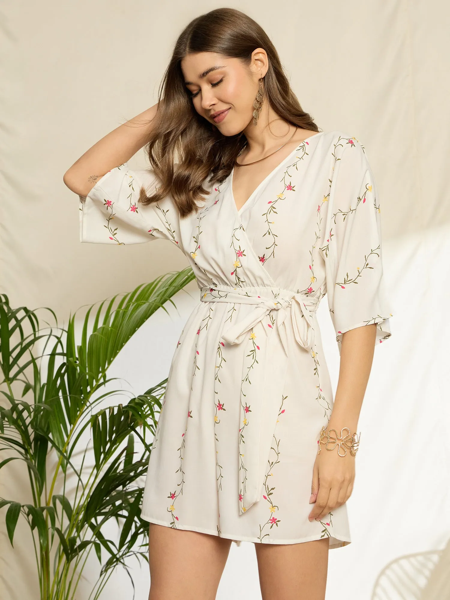 Berrylush Women White Floral Print V-Neck Belted Mini Jumpsuit