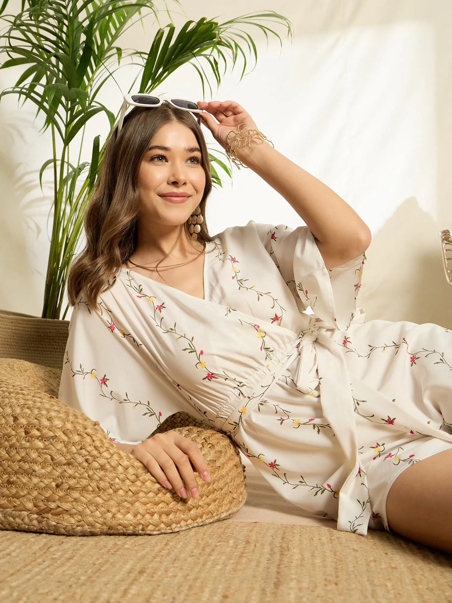 Berrylush Women White Floral Print V-Neck Belted Mini Jumpsuit